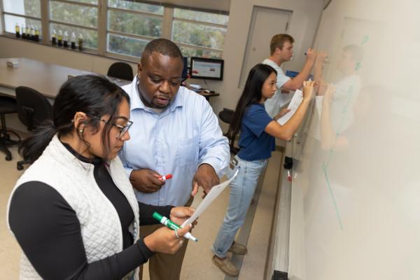 Professor Joe Larkin working through a problem with a student. Photo taken 11-10-22.